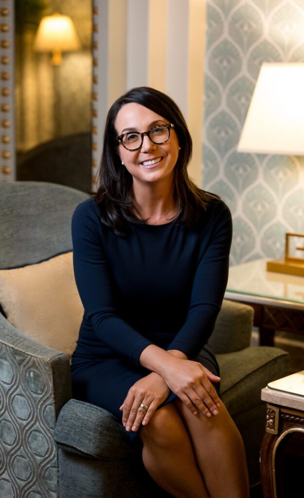 Dr. Caitlin Magraw, craniofacial surgeon, seated in her office